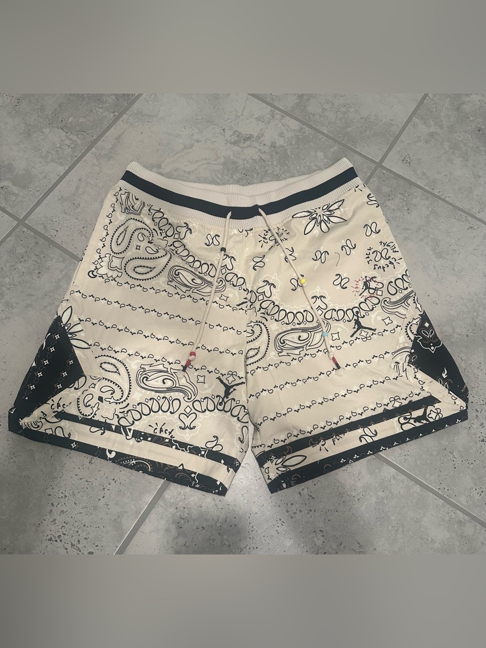 Travis Scott x Jordan Paisley Shorts in the "Orewood" colorway